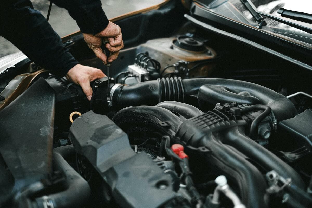 Mechanic checking a car engine at Lincs Auto Solutions